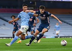 Arsenal's Kieran Tierney Faces Off Against Manchester City's Rodrigo in Premier League Clash