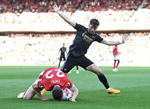 Images Dated 20th May 2023: Arsenal's Kieran Tierney Faces Off Against Nottingham Forest's Ryan Yates in Premier League Clash