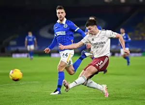 Arsenal's Kieran Tierney Faces Pressure from Brighton's Joel Veltman in Premier League Clash