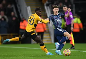 Wolverhampton Wanderers V Arsenal 2021-22 Prints: Arsenal's Kieran Tierney Faces Pressure from Wolves Francisco Trincao in Premier League Clash