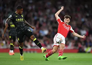 Arsenal's Kieran Tierney Fends Off Aston Villa's Leon Bailey During Premier League Clash at Emirates Stadium
