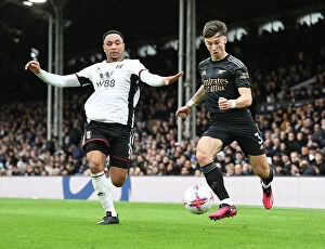 Images Dated 12th March 2023: Arsenal's Kieran Tierney Fends Off Fulham's Kenny Tete in Premier League Clash
