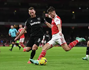 Arsenal's Kieran Tierney Fends Off West Ham's Vladimir Coufal in Premier League Clash