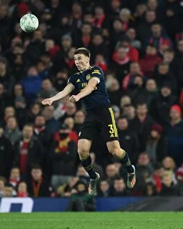 Liverpool v Arsenal - Carabao Cup 2019-20 Collection: Arsenal's Kieran Tierney Goes Head-to-Head with Liverpool in Carabao Cup Clash