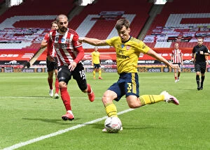 Sheffield United v Arsenal - FA Cup 2019-20 Collection: Arsenal's Kieran Tierney Goes Head-to-Head with Sheffield United's Kieran Freeman in FA Cup