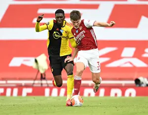 Arsenal's Kieran Tierney Goes Head-to-Head with Ismaila Sarr in Premier League Showdown