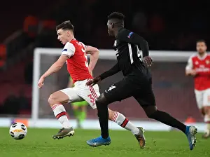 Arsenal's Kieran Tierney Outmaneuvers Eintracht Frankfurt's Danny Da Costa in UEFA Europa League Clash