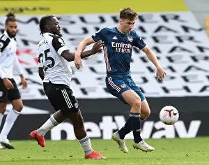 Arsenal's Kieran Tierney Outmaneuvers Fulham's Josh Onomah in Premier League Clash