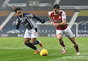 Arsenal's Kieran Tierney Outmaneuvers West Bromwich Albion's Matheus Pereira in Premier League Clash