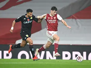 Arsenal's Kieran Tierney Outruns Aston Villa's Trezeguet in Empty Emirates Stadium