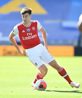 Brighton And Hove Albion V Arsenal 2019-20 Prints: Arsenal's Kieran Tierney Plays On: Empty Premier League Stadium