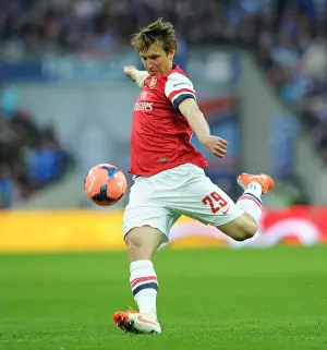 Arsenal's Kim Kallstrom in Action: FA Cup Semi-Final Showdown against Wigan Athletic, 2014
