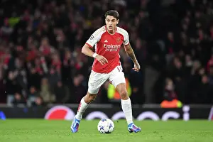 Arsenal V Sevilla 2023-24 Prints: Arsenal's Kiwior Charges Forward in UCL Showdown vs Sevilla at Emirates Stadium