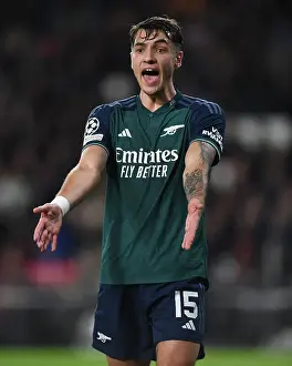 PSV Eindoven V Arsenal 2023-24 Prints: Arsenal's Kiwior Clashes with PSV Eindhoven in Champions League Battle