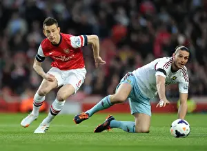 Arsenal's Koscielny Brushes Off Andy Carroll's Challenge During Arsenal v West Ham United (2013/14)