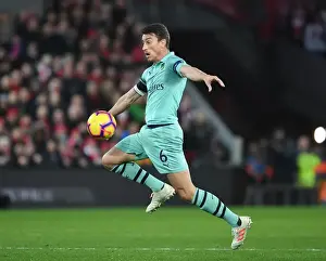 Arsenal's Koscielny Faces Off Against Liverpool in Premier League Clash
