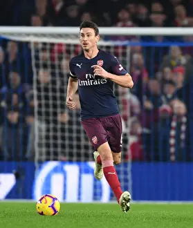 Brighton And Hove Albion V Arsenal 2018-19 Prints: Arsenal's Koscielny Focuses in Intense Premier League Clash Against Brighton