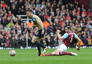West Ham United V Arsenal 2015-16 Prints: Arsenal's Koscielny Fouled by Carroll in Intense West Ham vs Arsenal Clash (2015-16)
