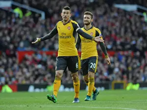 Manchester United V Arsenal 2016-17 Prints: Arsenal's Koscielny and Mustafi Face Off Against Manchester United