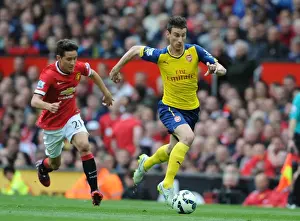 Manchester United V Arsenal 2014-15 Prints: Arsenal's Koscielny Outmaneuvers Herrera in Intense Premier League Showdown (2014-15)