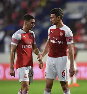 Al-Nasr Dubai SC V Arsenal 2018-19 Prints: Arsenal's Koscielny and Pleguezuelo in Action against Al-Nasr Dubai SC