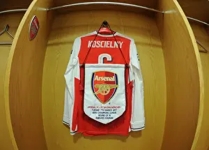 Arsenal V Bayern Munich 2016-17 Prints: Arsenal's Koscielny Prepares for Bayern Showdown: A Peek into the Changing Room