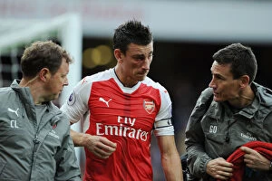Images Dated 10th September 2016: Arsenal's Koscielny Receives Medical Attention During Arsenal vs Southampton Match, 2016-17