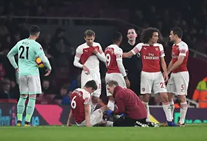 Arsenal V Bournemouth 2018-19 Prints: Arsenal's Koscielny Receives Treatment from Physio Jordan Reece during Arsenal v Bournemouth Match