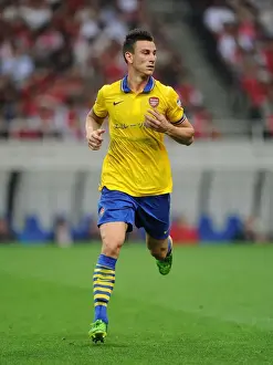Uwara Red Diamonds V Arsenal 2013-14 Prints: Arsenal's Koscielny Takes on Urawa Red Diamonds in 2013 Pre-Season Clash