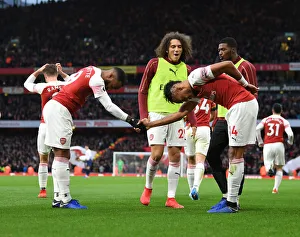 Arsenal's Lacazette and Aubameyang: Unstoppable Duo Celebrates Goals Against Tottenham in the 2018-19 Premier League Clash