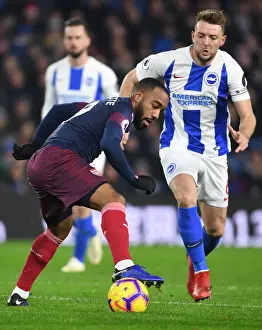 Brighton And Hove Albion V Arsenal 2018-19 Prints: Arsenal's Lacazette Clashes with Brighton's Stephens in Premier League Showdown