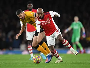 Arsenal's Lacazette Clashes with Coady in Intense Premier League Showdown at Emirates Stadium