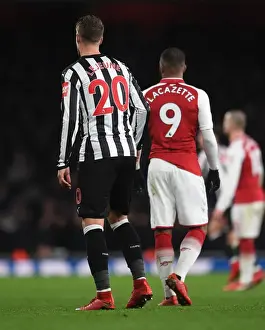Arsenal V Newcastle United 2017-18 Prints: Arsenal's Lacazette Clashes with Newcastle's Lejeune in Premier League Showdown