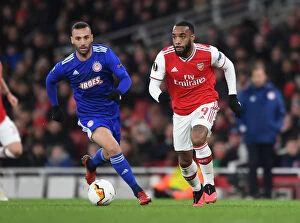 Images Dated 28th February 2020: Arsenal's Lacazette Clashes with Olympiacos Guilherme in Europa League Showdown