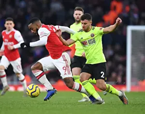 Arsenal V Sheffield United 2019-20 Prints: Arsenal's Lacazette Clashes with Sheffield United's Baldock in Premier League Showdown