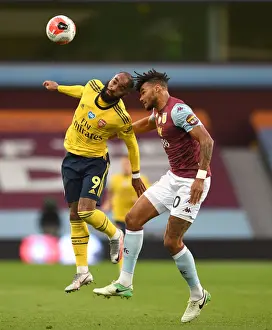 Arsenal's Lacazette Clashes with Villa's Mings in Premier League Showdown