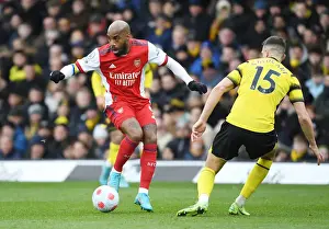 Watford V Arsenal 2021-22 Prints: Arsenal's Lacazette Clashes with Watford's Cathcart in Premier League Showdown