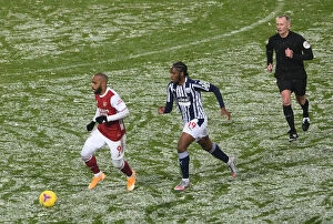 Images Dated 3rd January 2021: Arsenal's Lacazette Clashes with West Brom's Sawyers in Premier League Showdown