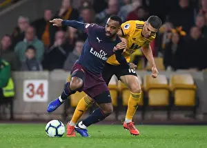Arsenal's Lacazette Clashes with Wolverhampton's Coady in Premier League Showdown