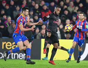 Crystal Palace V Arsenal 2017-18 Prints: Arsenal's Lacazette and Crystal Palace's Dann Clash in Intense Premier League Showdown