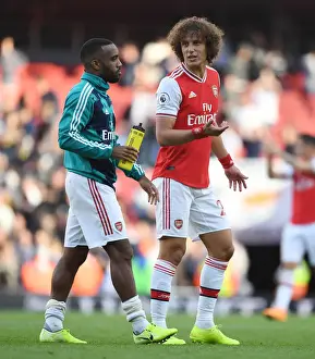 Arsenal's Lacazette and David Luiz: Savoring Their Hard-Fought Victory Over Tottenham