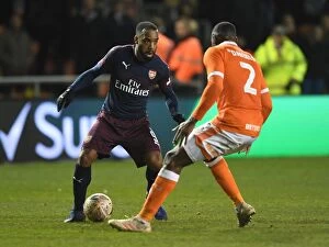 Images Dated 5th January 2019: Arsenal's Lacazette Faces Off Against Blackpool's Daniels in FA Cup Clash