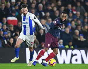 Brighton And Hove Albion V Arsenal 2018-19 Prints: Arsenal's Lacazette Faces Off Against Brighton's Propper in Premier League Clash