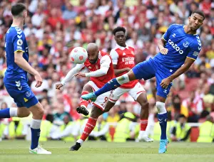 Arsenal V Everton 2021-22 Prints: Arsenal's Lacazette Faces Off Against Everton's Holgate in Intense Premier League Showdown