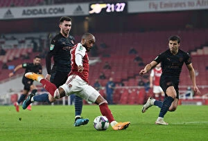 Arsenal v Manchester City - Carabao Cup 2020-21 Collection: Arsenal's Lacazette Faces Off Against Manchester City's Laporte
