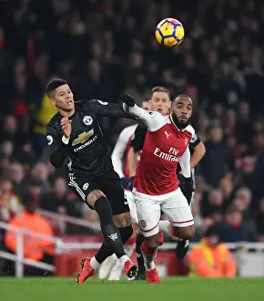 Arsenal V Manchester United 2017-18 Prints: Arsenal's Lacazette Faces Off Against Manchester United's Rojo in Intense Premier League Clash
