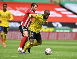 Sheffield United V Arsenal - FA Cup 2019-20 Prints: Arsenal's Lacazette Faces Off Against Sheffield United's Egan in FA Cup Quarterfinal Clash