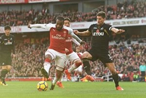 Images Dated 28th October 2017: Arsenal's Lacazette Faces Off Against Swansea's Fernandez