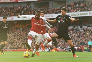 Arsenal V Swansea City 2017-18 Prints: Arsenal's Lacazette Faces Off Against Swansea's Fernandez