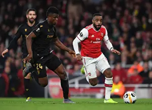 Arsenal V Vitoria Club 2019-20 Prints: Arsenal's Lacazette Faces Off Against Vitoria's Mikel Agu in Europa League Clash